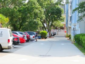 Villas access road entry, parking on left